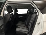 a white car with two black seats in the back of it