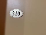 a picture of a door with the number 210 on it