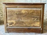 an old wooden chest with peeling paint on it