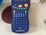 a blue calculator sitting on top of a table