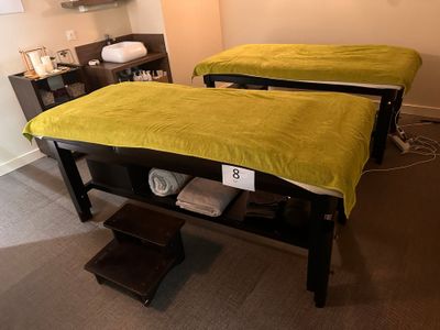 two beds that are sitting in a room together