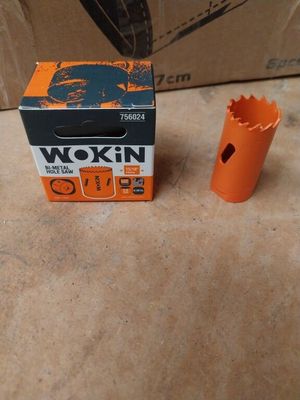 a box of orange tools on the floor next to a box of orange tools