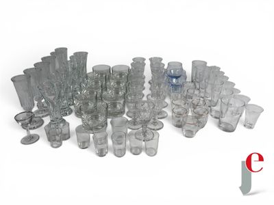 a lot of glasses and cups sitting on a table