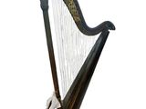 an image of a black harp sitting on top of a white surface