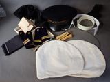 a hat, gloves, tie, and other items on a table