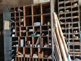a room with a bunch of baseball bats and other items