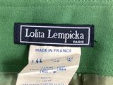 a label on a green jacket that says lotta lemonicka paris