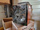 a fan that is sitting on top of a box