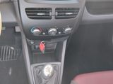 a dashboard of a car with buttons and a steering wheel