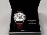 a watch in a black box on a white surface