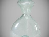 a glass vase that is sitting on a table