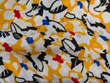 an image of a close up of a yellow and black cat print fabric