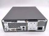a black and silver computer on a white surface