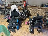 many different types of wheelchairs in this garage