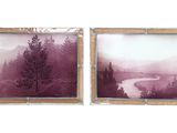 two pictures hanging on the wall of a room