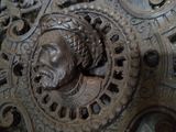 a wooden carving of a man with a beard on it