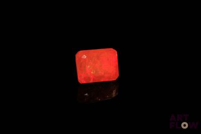 a red light that is glowing in the dark