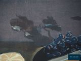 a painting of a bowl of grapes and a plate of bread