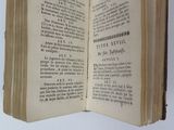 an open book that is sitting on a table