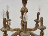 an image of a chandelier with three lights on each of it