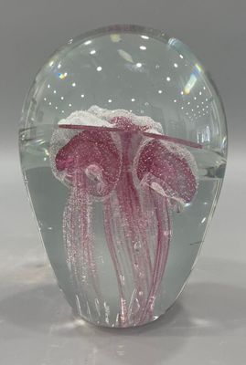 a glass vase with a pink jelly inside of it