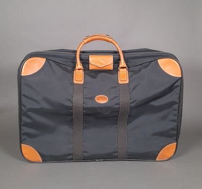an image of a black and orange suitcase on a grey background
