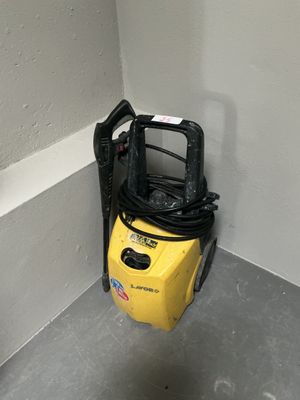 a yellow and black vacuum in the corner of a room
