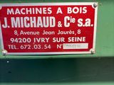 a sign that says machine a bois j michael and s a