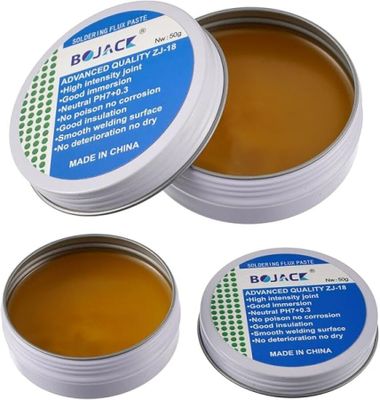 a close up of two tins of lip bales on a white background