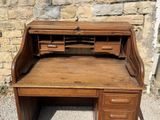 a wooden desk with a drawer on top of it