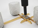 a candle holder that is made of wood and glass