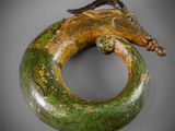 an image of a green and gold bracelet with a lizard on it
