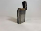 an image of a lighter that is sitting on a white surface