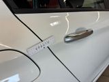 a close up of a car door handle with a sticker on it