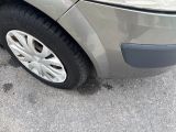 a close up of a car ' s tire on the pavement
