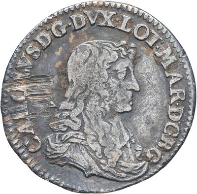 une pièce d'argent portant l'image d'un homme