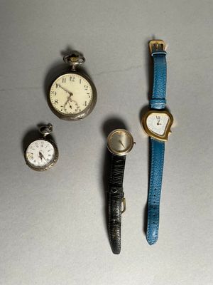 several different types of watches are displayed on a table