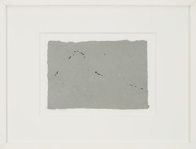 an image of a piece of paper with a black dot on it