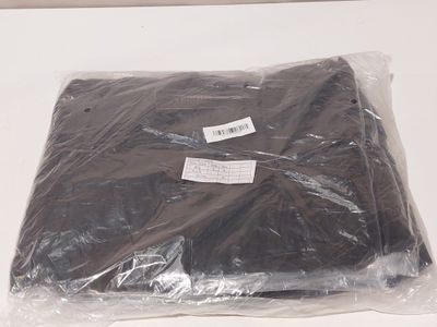 a bag of black clothing sitting on a table