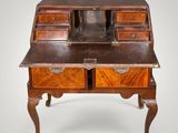 an old wooden desk with drawers and drawers on top of it