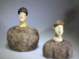 pair of ceramic figurines of a man and a woman
