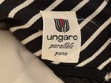 a close up of a striped shirt with a tag on it