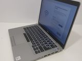 a laptop computer sitting on a table with a webpage on the screen
