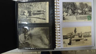 an open book with pictures of people and animals on it