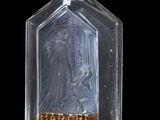 a glass bottle that has a picture of a woman on it