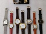 a lot of watches that are sitting on a table