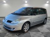 an image of a silver minivan parked in a garage