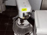 a machine that is sitting in a kitchen next to a sink