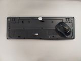 a black computer mouse sitting on top of a black keyboard
