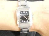 a person that is wearing a watch on their wrist